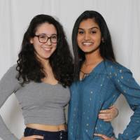 two girls with hands on hips pose